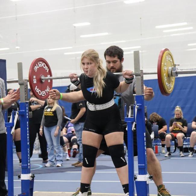 Powerlifting club student competing 